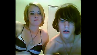 A sexy girl performs oral sex on her adorable emo boyfriend during a web cam session