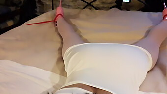 Laura, Clad In A Seductive White Dress, Pink Pantyhose, And Elevated Heels, Bound And Silenced On A Bed