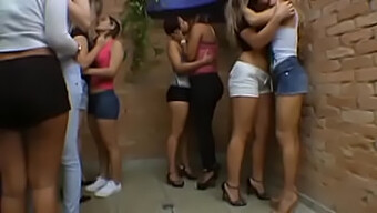 A line of kisses: Karina Cruel and several other women engage in lesbian activities